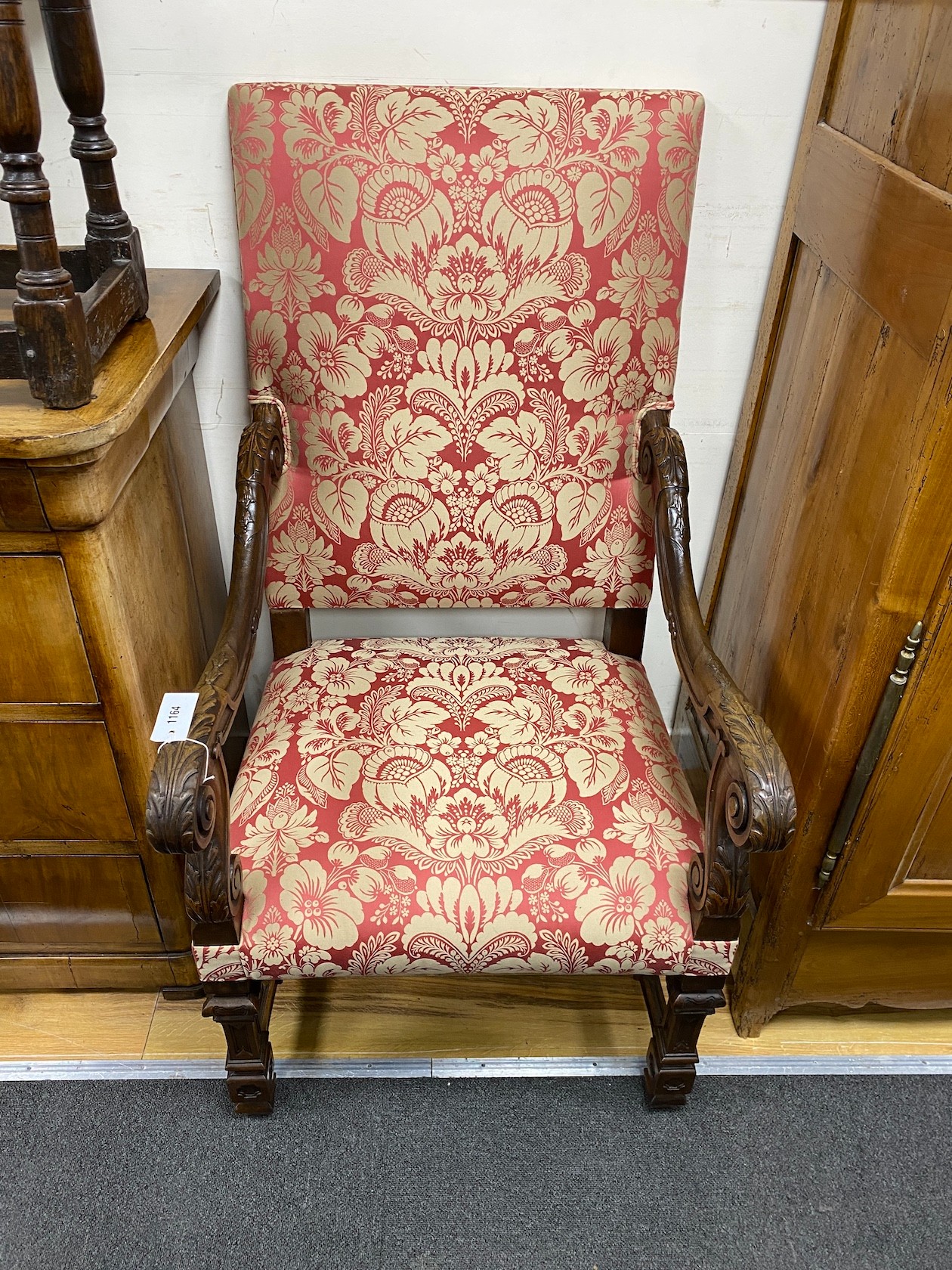 An early 20th century French carved walnut open armchair, width 62cm, depth 76cm, height 108cm
